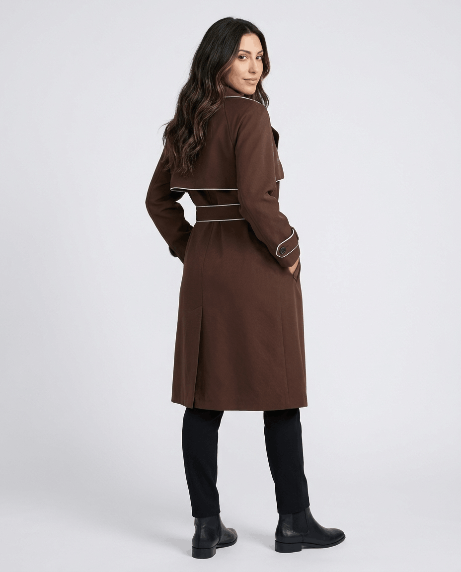 Brown belted trench coat for women worn by a female model, back view with defined waist and tie belt