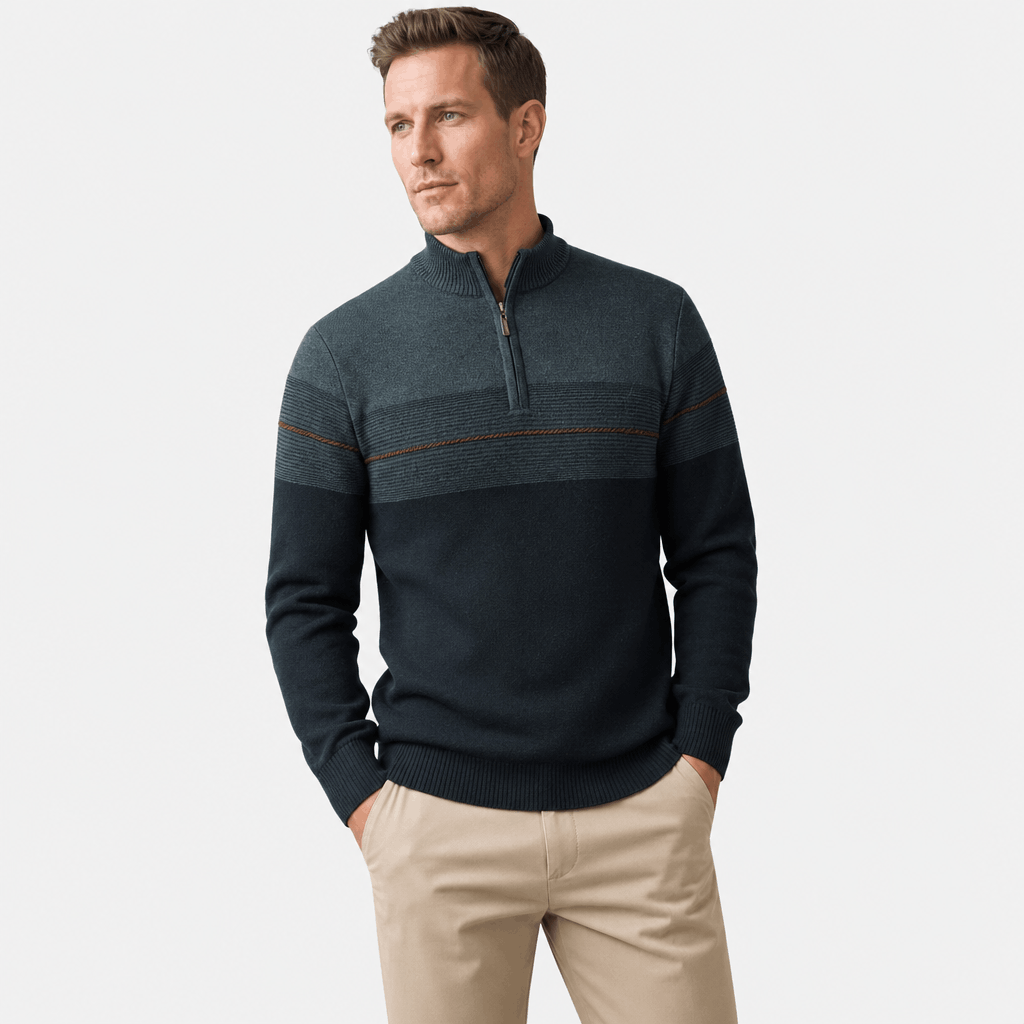 Man wearing the dark teal quarter-zip sweater with beige pants.