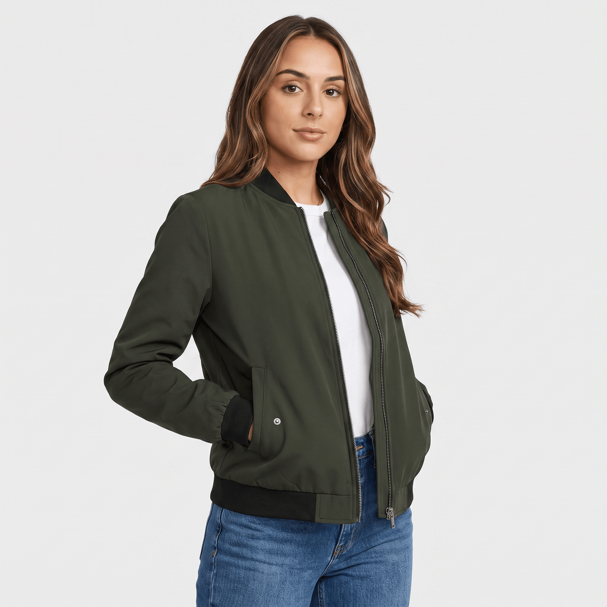 Female model wearing an olive green bomber jacket over a white top with blue jeans, featuring a ribbed collar, cuffs, and hem.