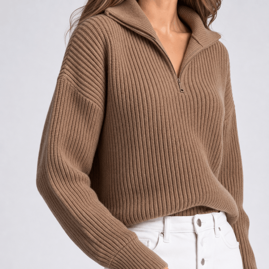 Close-up showing the ribbed knit texture and half-zip neckline of the taupe brown sweater.