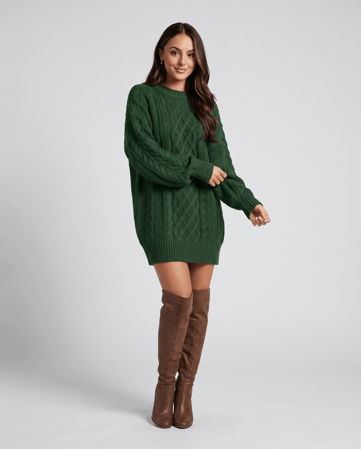 Green Cable Knit Sweater worn by a female model with a short skirt and tall boots, highlighting the oversized silhouette, cable knit texture, and long balloon sleeves.