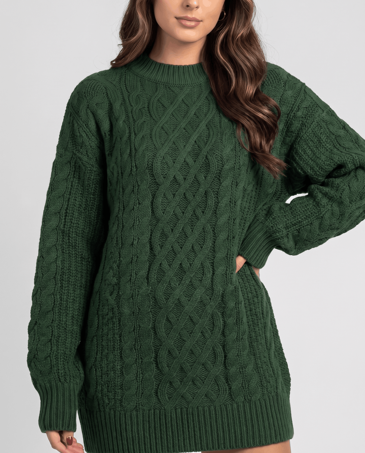 Green Cable Knit Sweater worn by a female model, shown in close-up to highlight the textured cable knit pattern, oversized fit, and balloon sleeves.