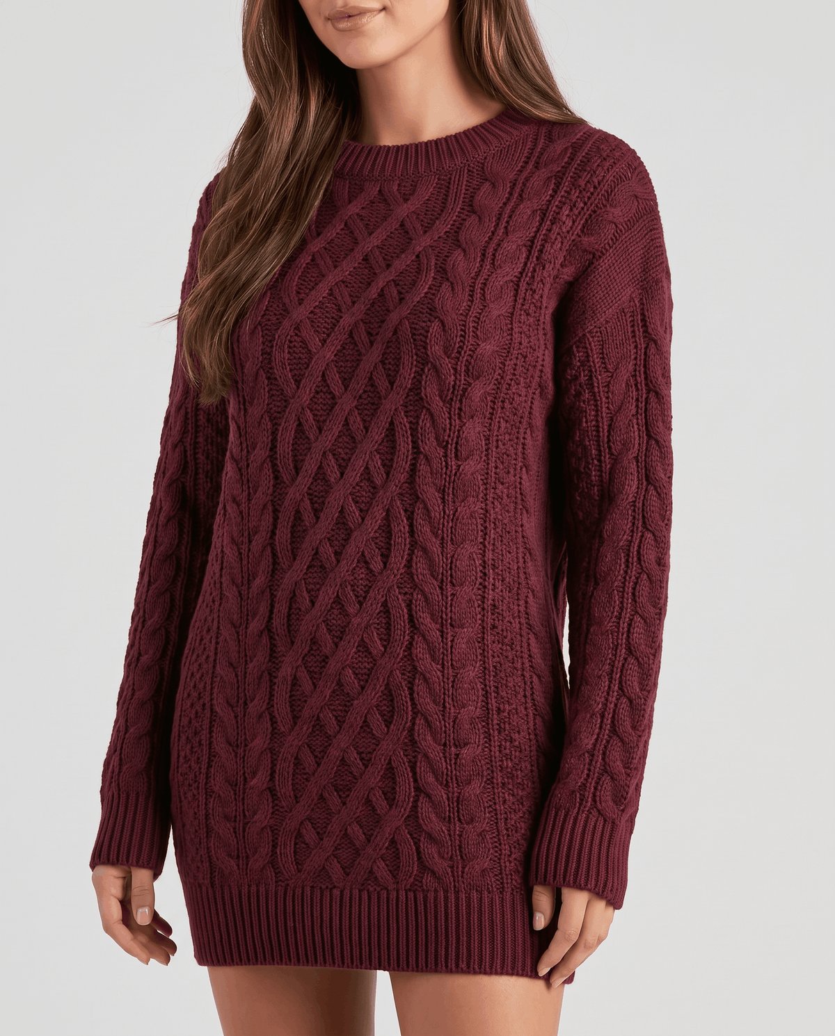 Burgundy Cable Knit Sweater worn by a female model, featuring an oversized fit, textured cable knit pattern, and long balloon sleeves.