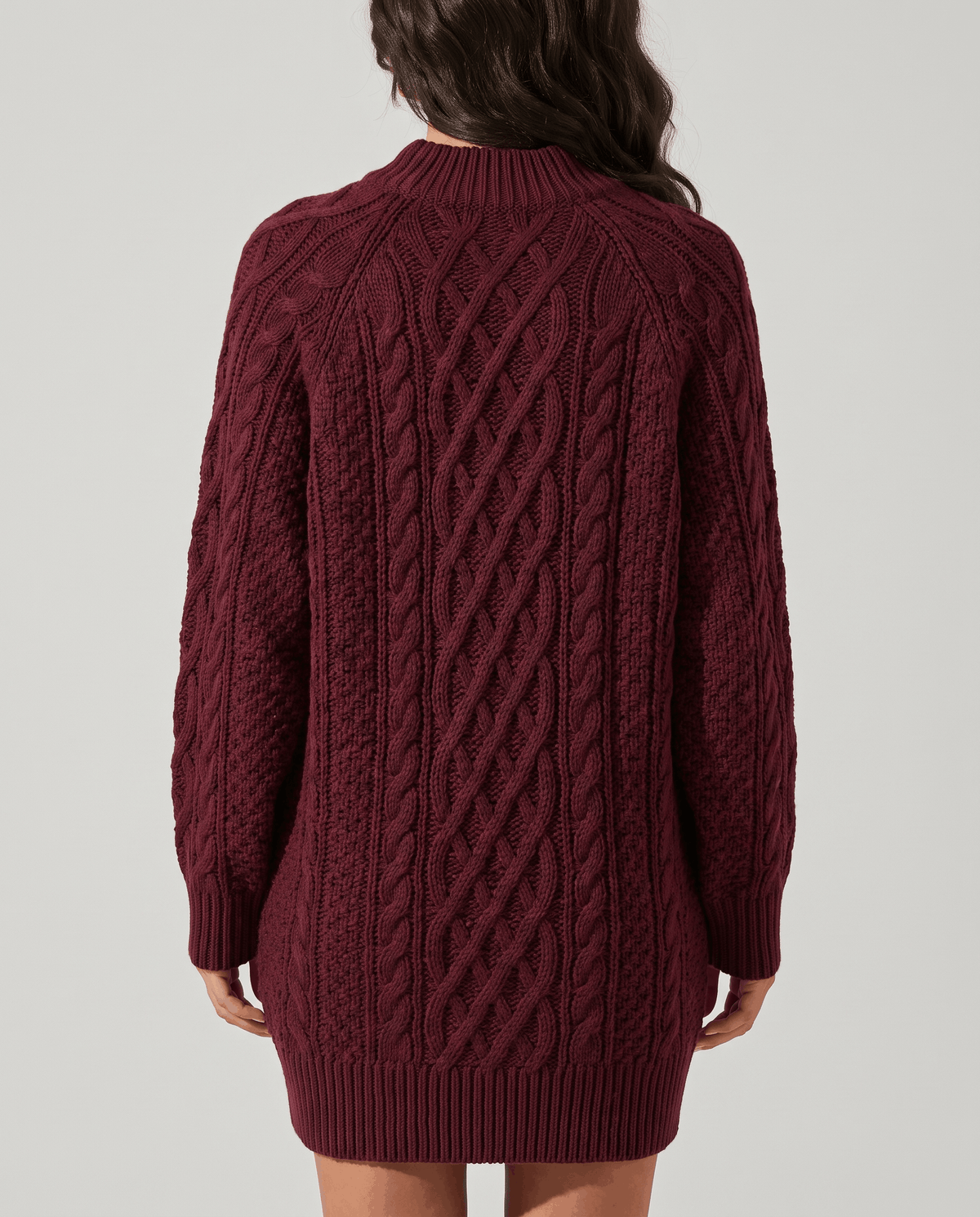 Burgundy Cable Knit Sweater worn by a female model from the back, highlighting the textured cable knit pattern, oversized silhouette, and long sleeves.