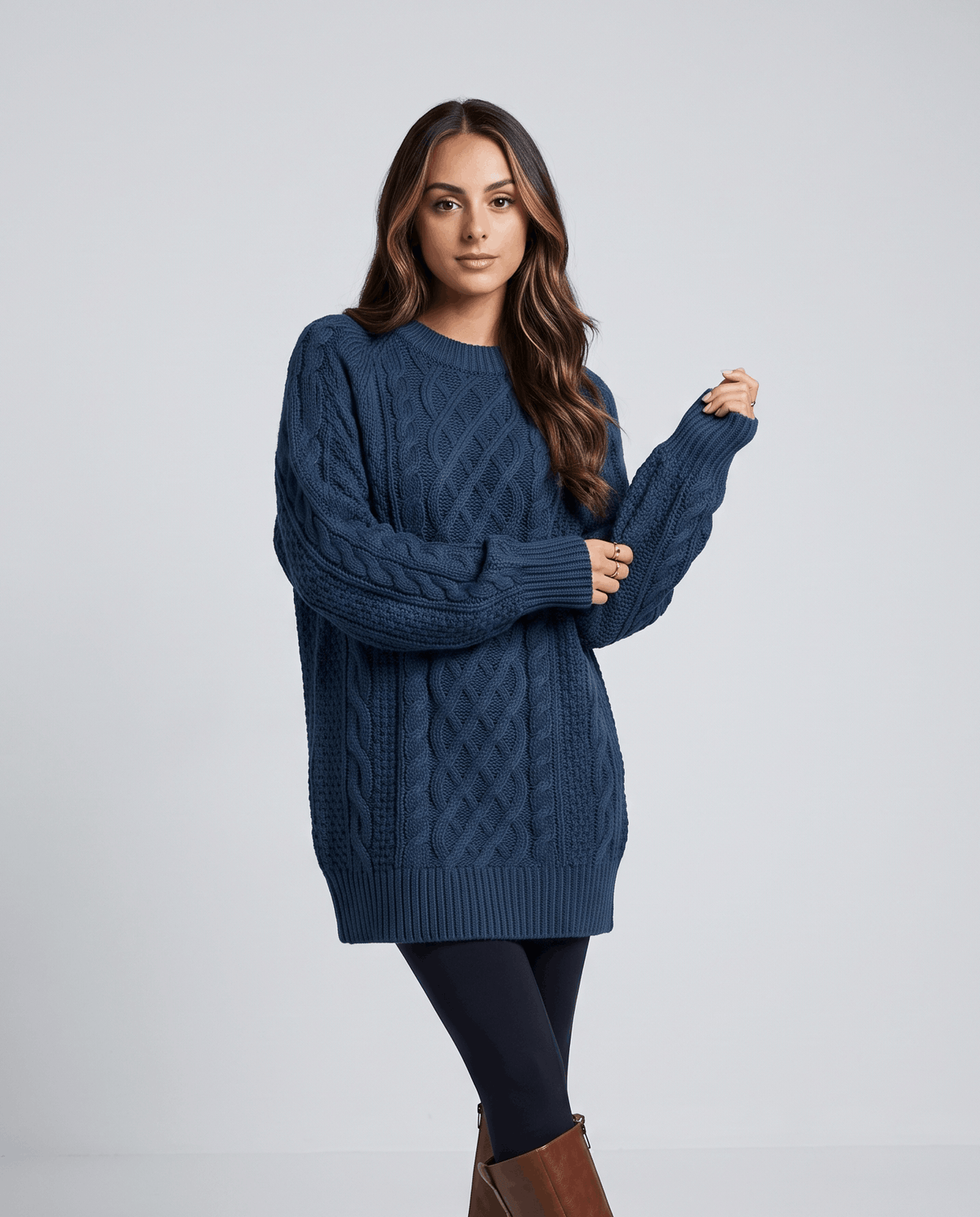 Blue Cable Knit Sweater worn by a female model, featuring an oversized fit, textured cable knit pattern, long balloon sleeves, and a relaxed silhouette.