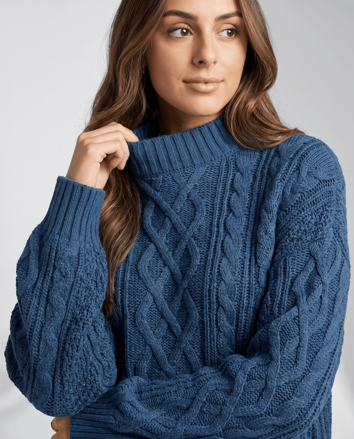 Blue Cable Knit Sweater worn by a female model, shown in close-up with the cable knit texture, oversized fit, and long balloon sleeve.