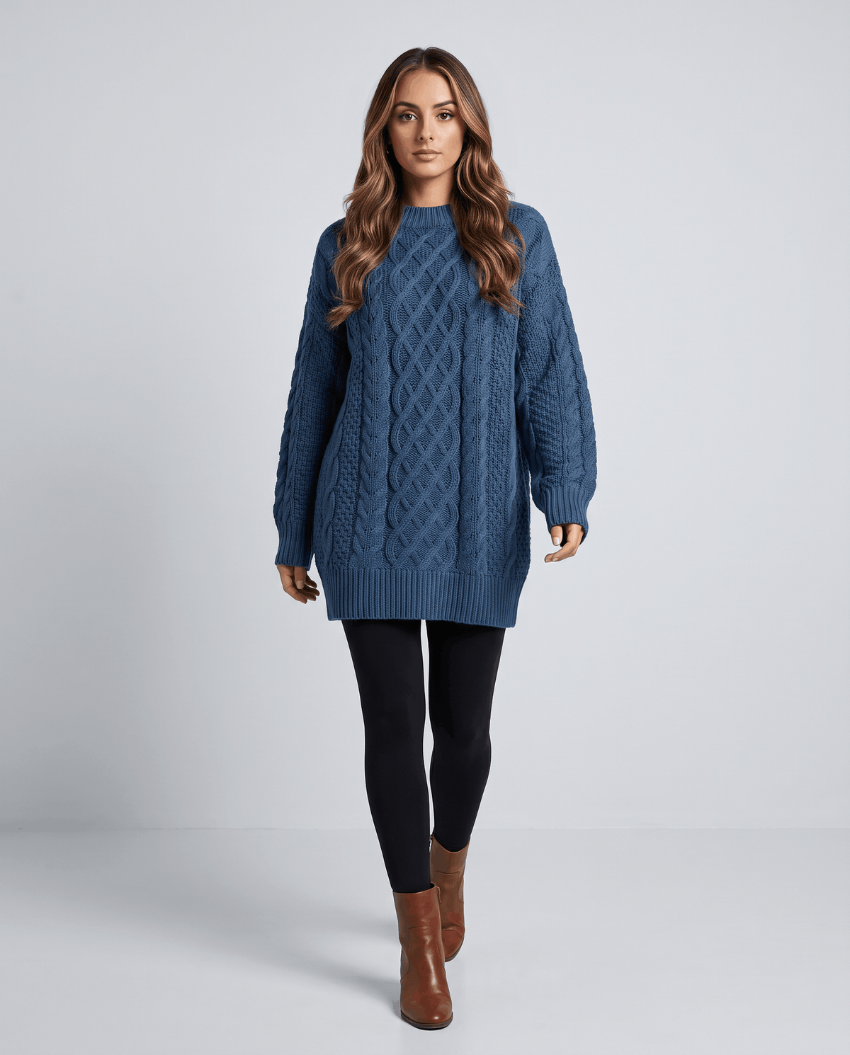 Blue Cable Knit Sweater worn by a female model with black leggings, featuring an oversized fit, textured cable knit pattern, long balloon sleeves, and relaxed silhouette.