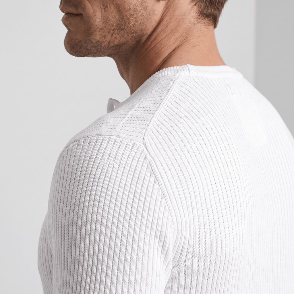White ribbed knit henley sweater featuring a structured regular fit and a four-button placket neckline.