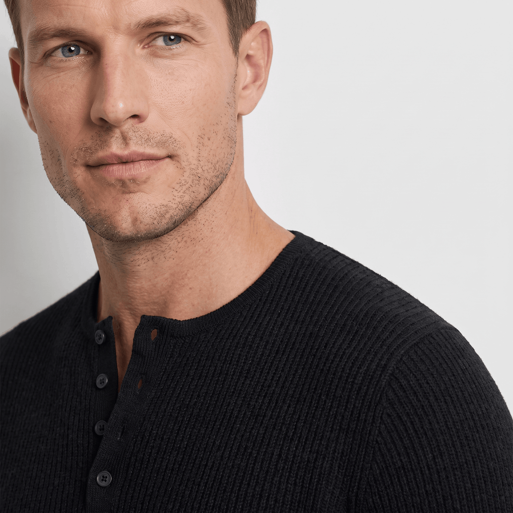 Black ribbed knit henley sweater featuring a four-button placket and a structured regular fit.