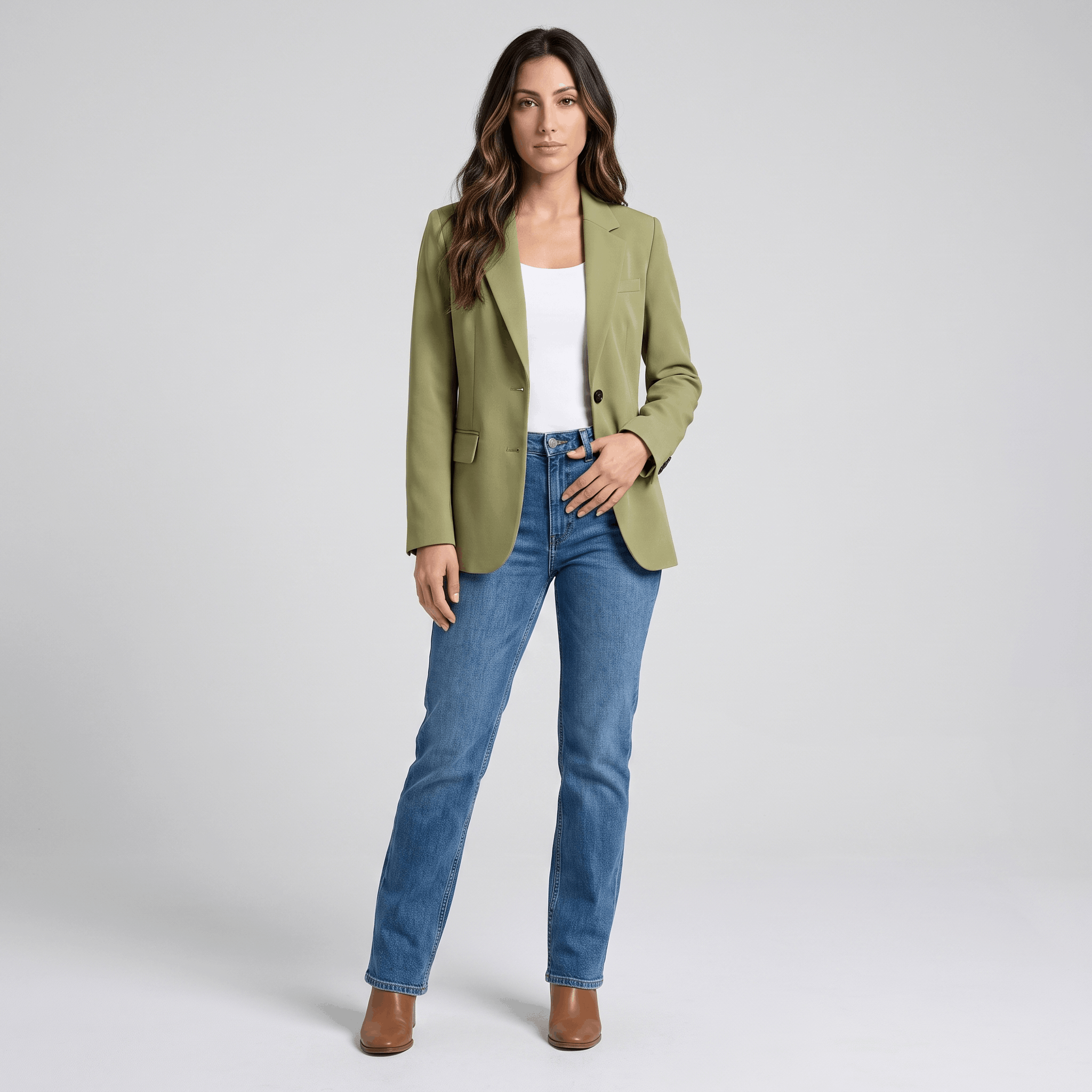 Female model wearing the olive green blazer with a light top, blue jeans, and heels.