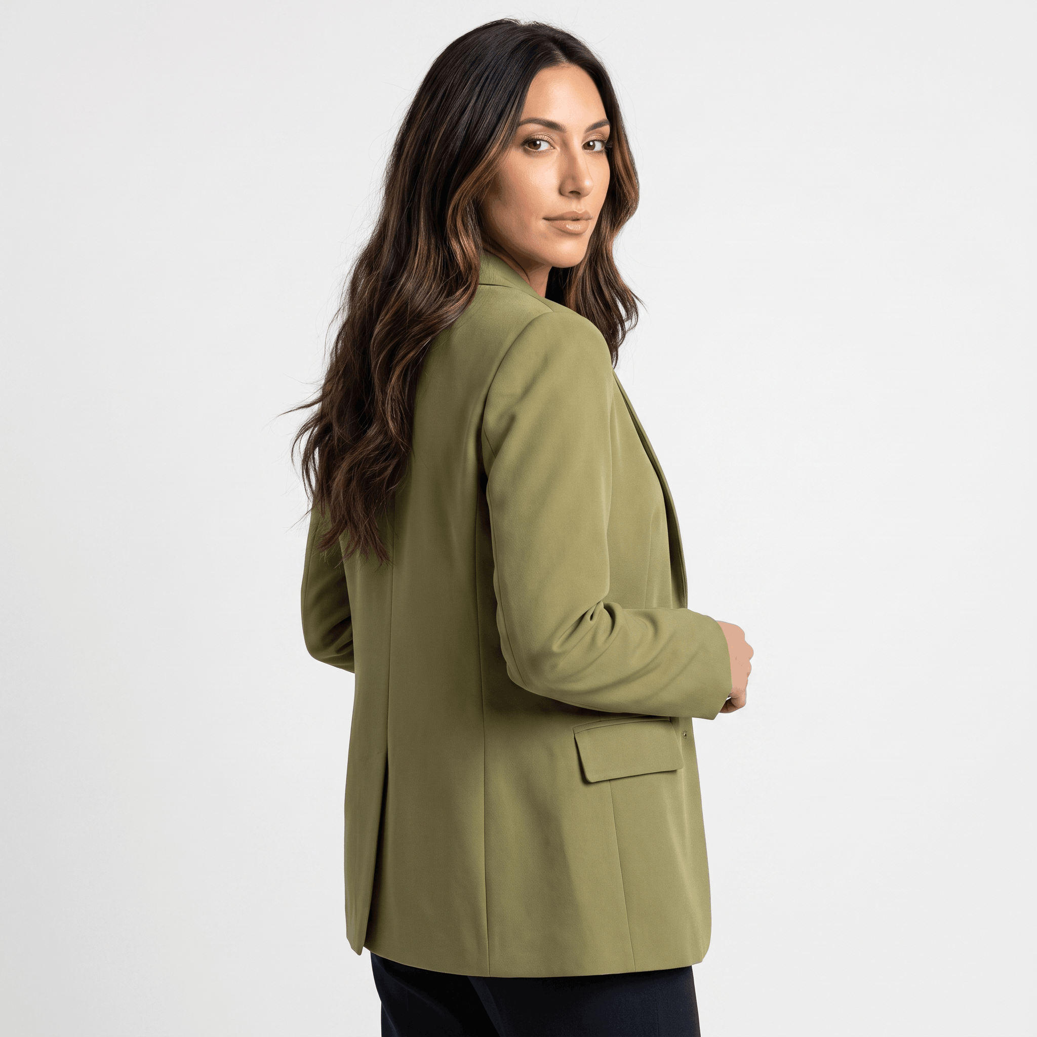 Female model wearing an olive green tailored blazer with a fitted silhouette.