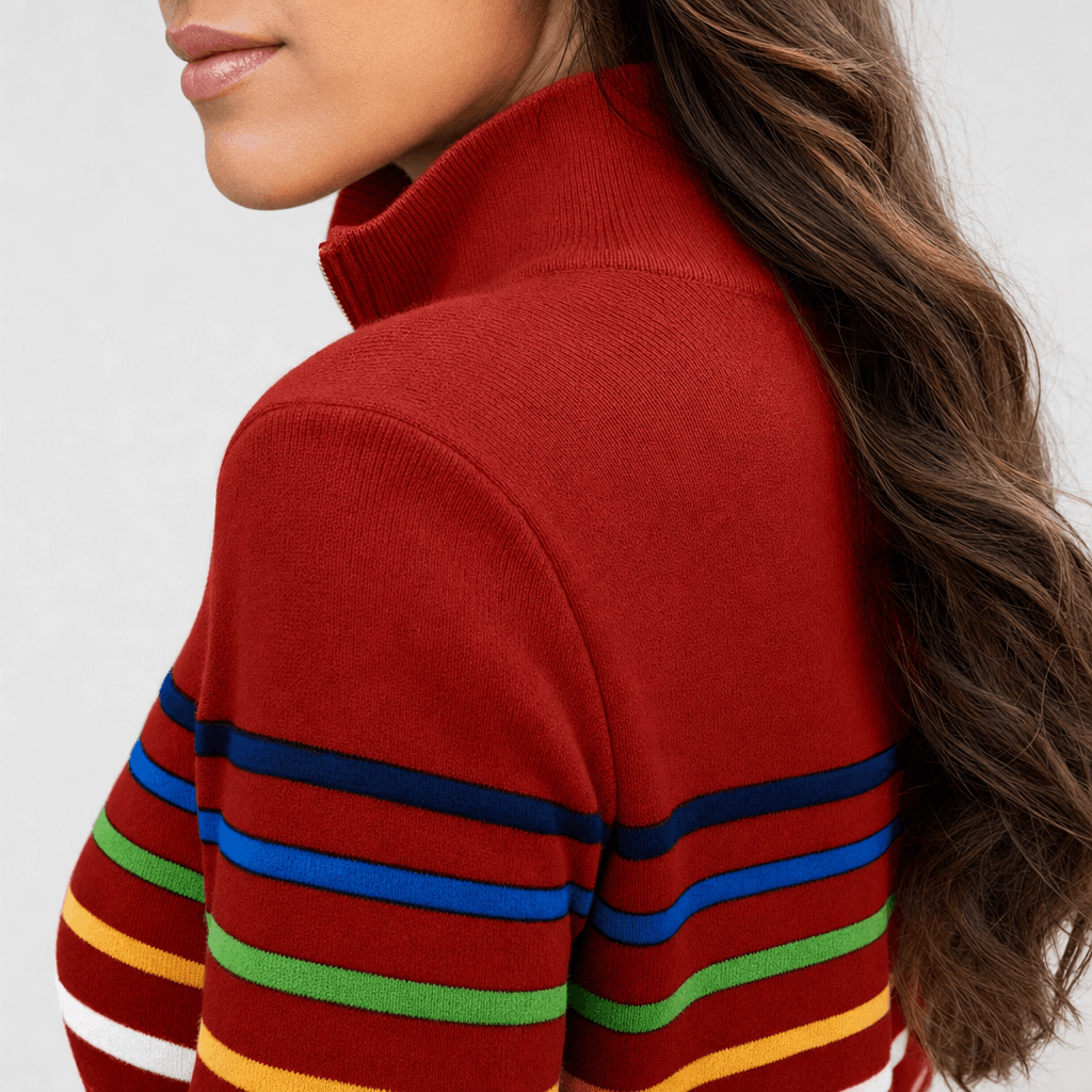 Close-up back and side view of the red sweater, highlighting the raised collar and colorful striped pattern across the upper back and sleeves.
