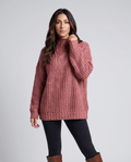 Pink Chunky Cable Knit Sweater worn by a female model, featuring a mock neck, relaxed fit, textured cable knit pattern, and long sleeves.