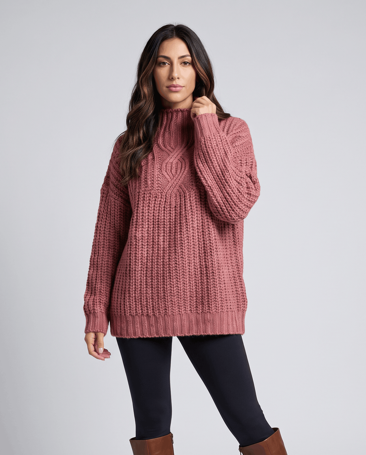 Pink Chunky Cable Knit Sweater worn by a female model, featuring a mock neck, relaxed fit, textured cable knit pattern, and long sleeves.