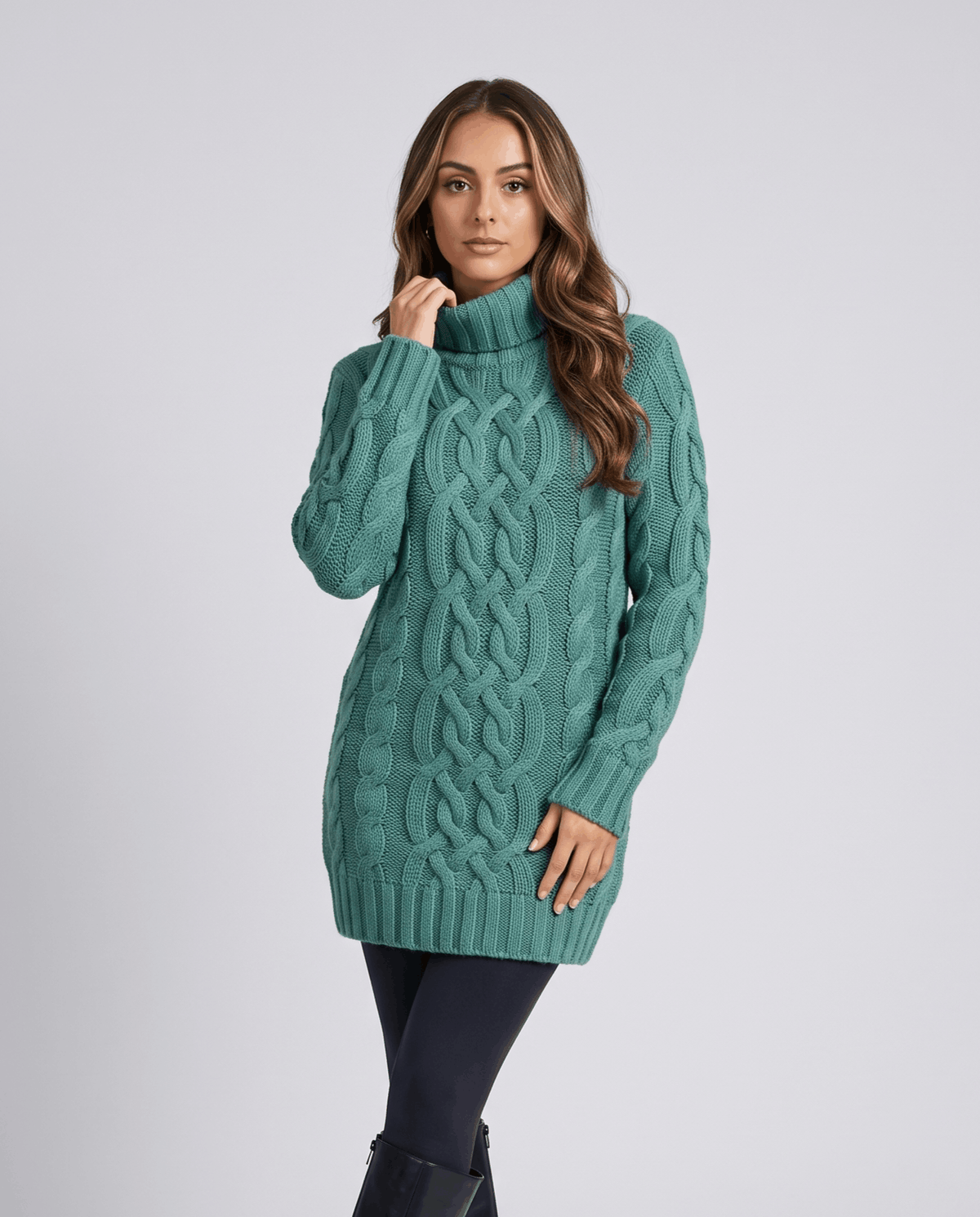 Teal Chunky Cable Knit Sweater worn by a female model, featuring a turtleneck, textured cable knit pattern, long sleeves, and ribbed trim.