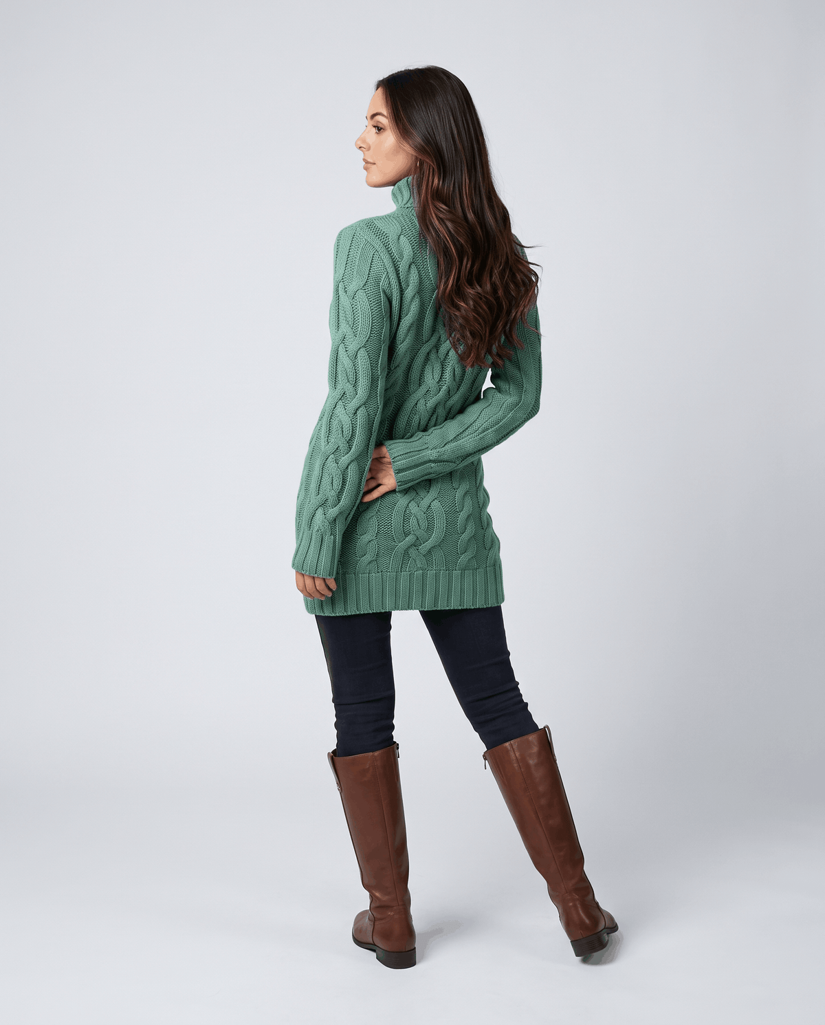 Purple Chunky Cable Knit Sweater worn by a female model, featuring a turtleneck, textured cable knit pattern, long sleeves, and ribbed trim.