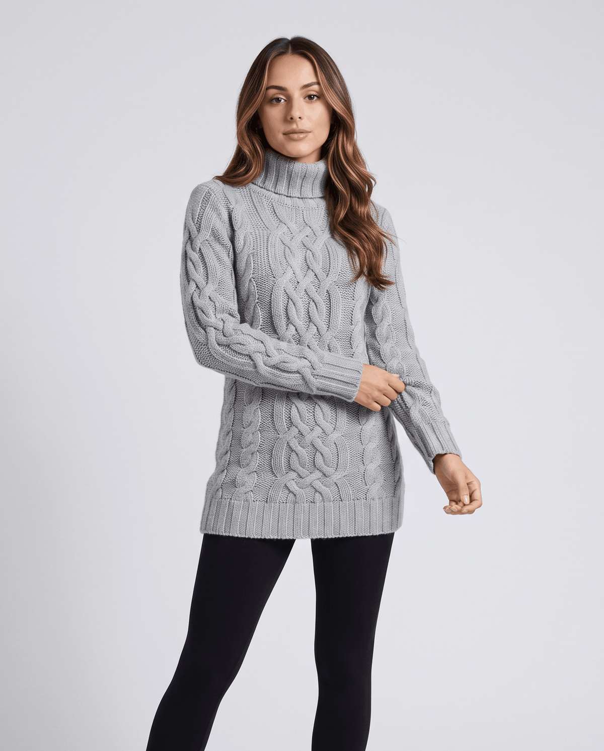 Gray Chunky Cable Knit Sweater worn by a female model, featuring a turtleneck, textured cable knit pattern, long sleeves, and ribbed trim.