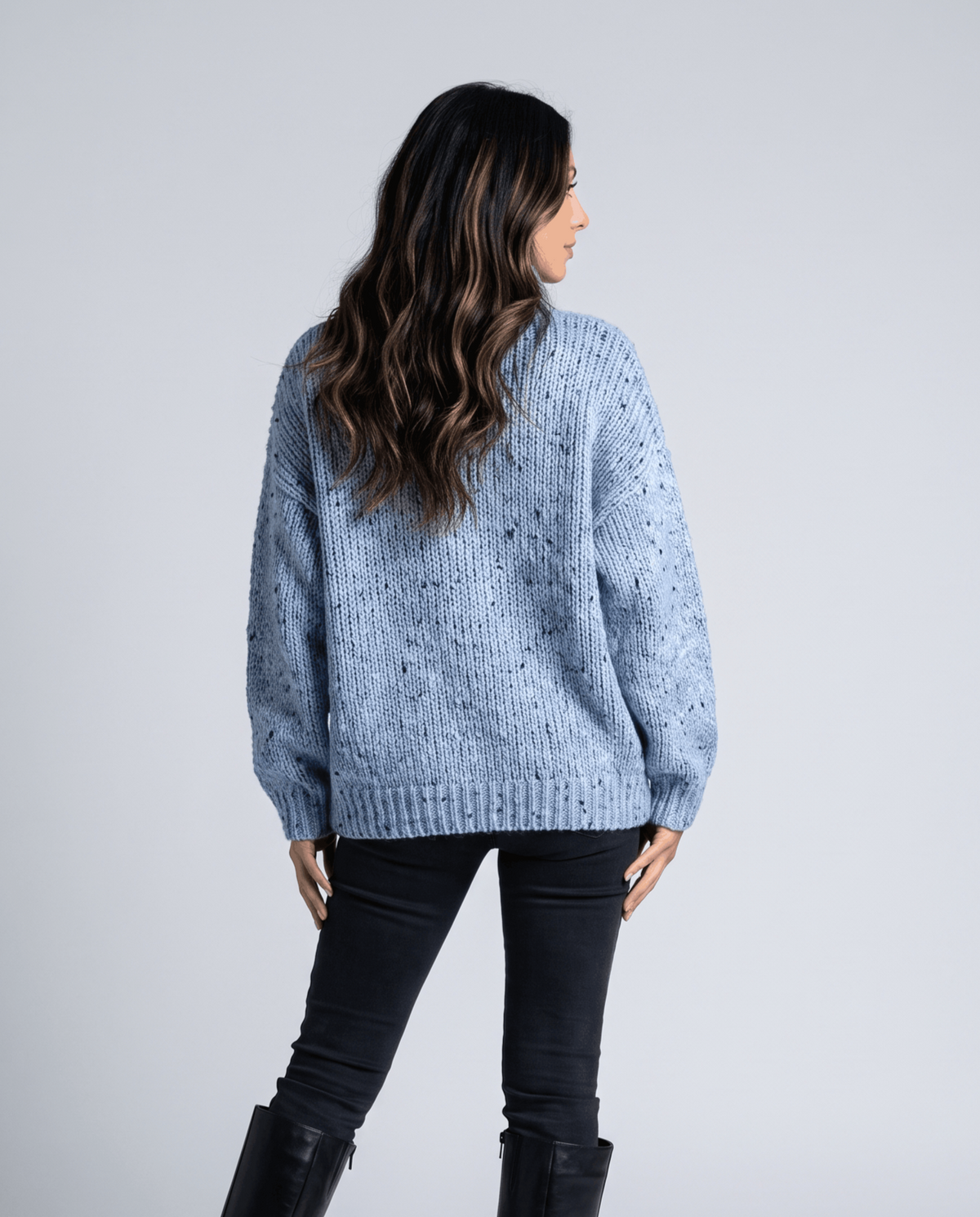 Blue Chunky Knit Sweater worn by a female model from the back, showcasing the oversized fit, chunky knit texture, long sleeves, and ribbed hem.
