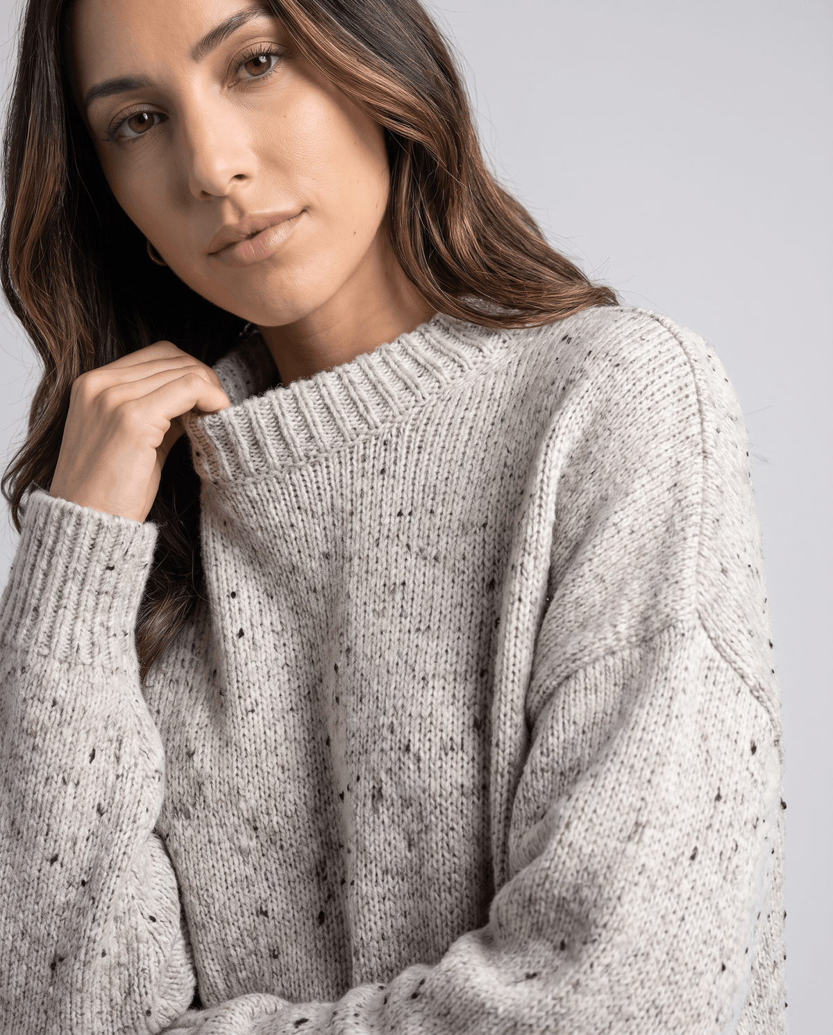 Beige Chunky Knit Sweater worn by a female model, shown in close-up to highlight the chunky knit texture, relaxed oversized fit, and balloon sleeve.
