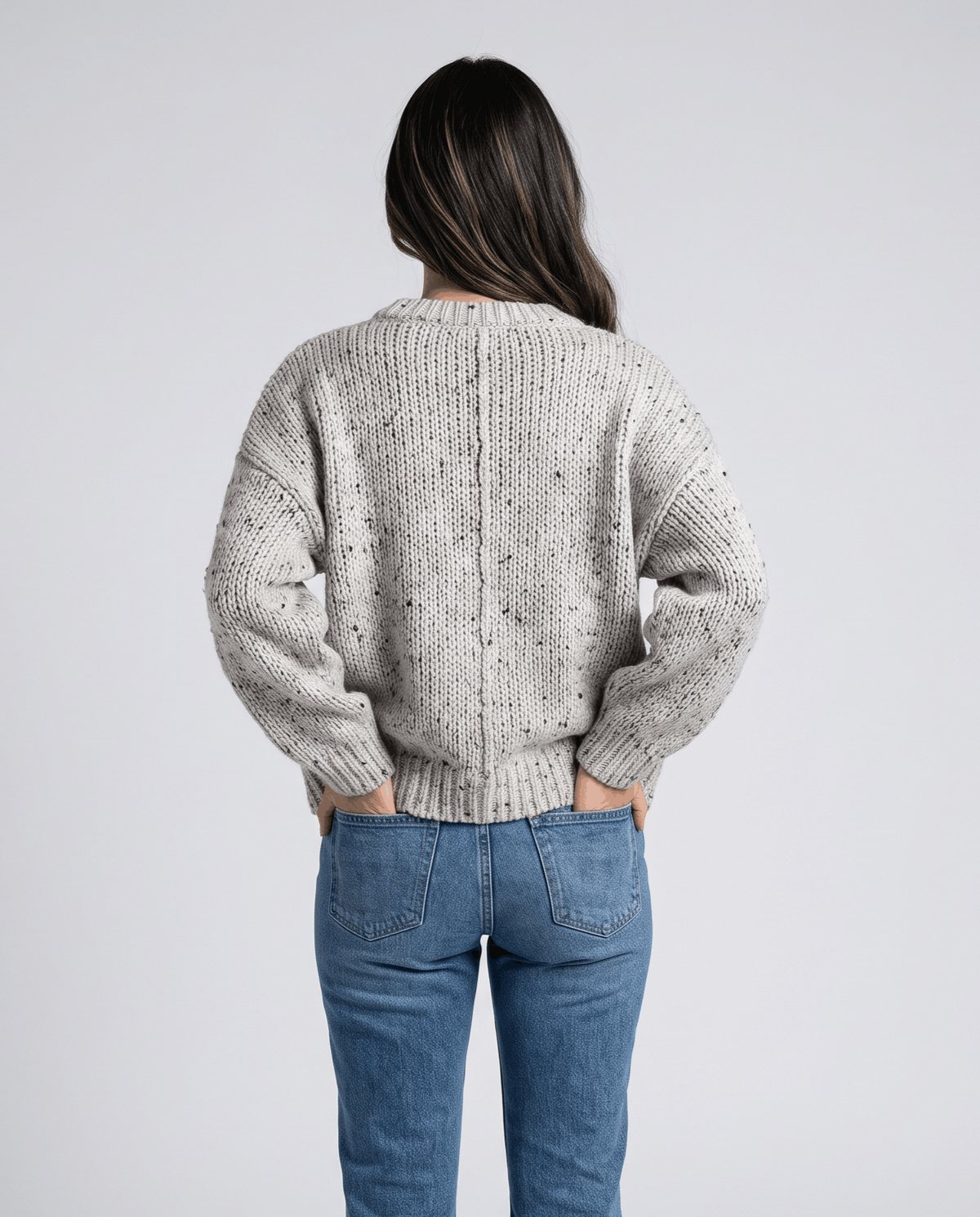 Beige Chunky Knit Sweater worn by a female model from the back, highlighting the oversized silhouette, chunky knit texture, and balloon sleeves.