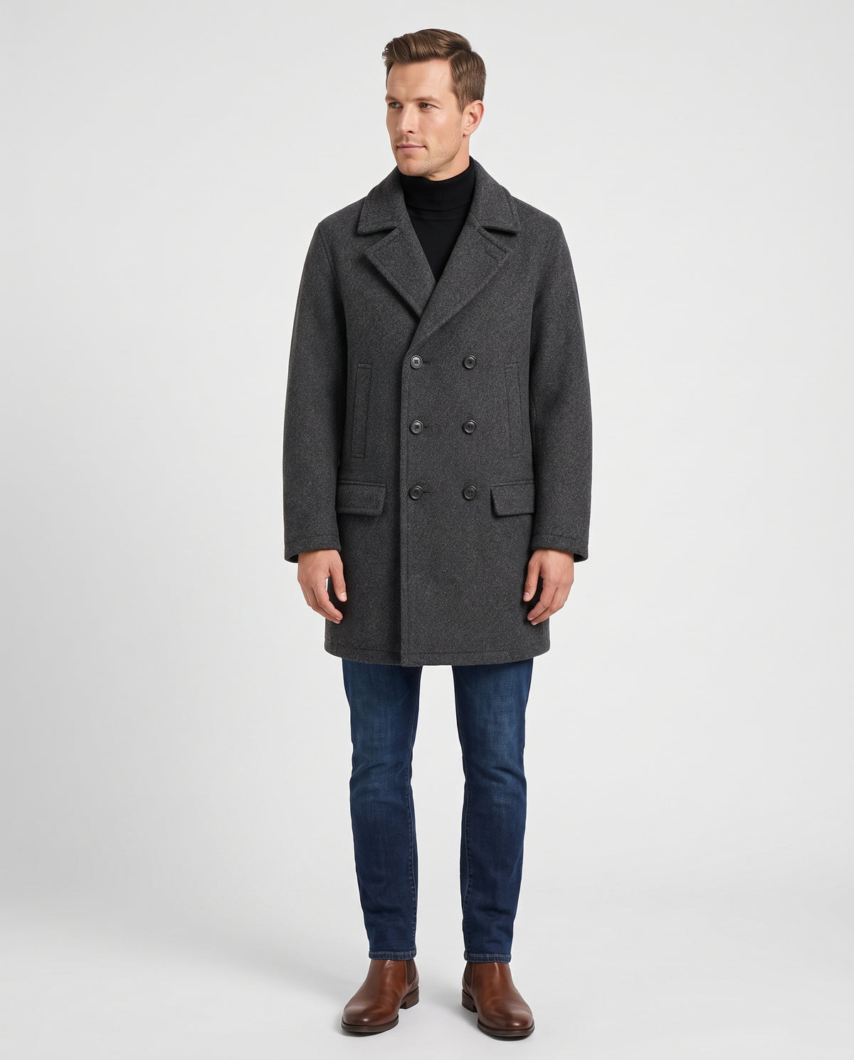 A man wearing a gray classic double-breasted trench coat with a longline fit and tailored lapels