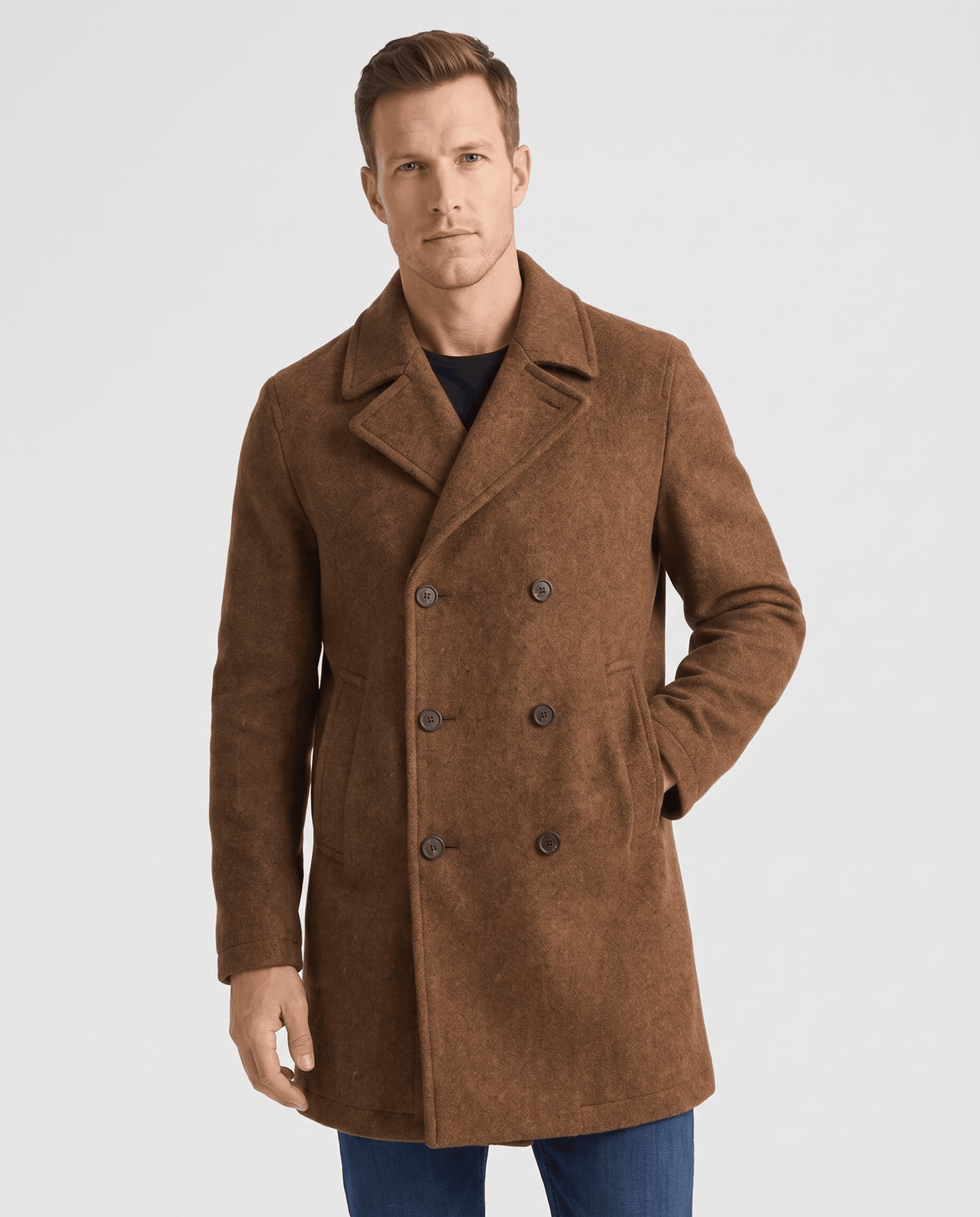 Brown double-breasted longline trench coat with tailored lapels worn by a male model