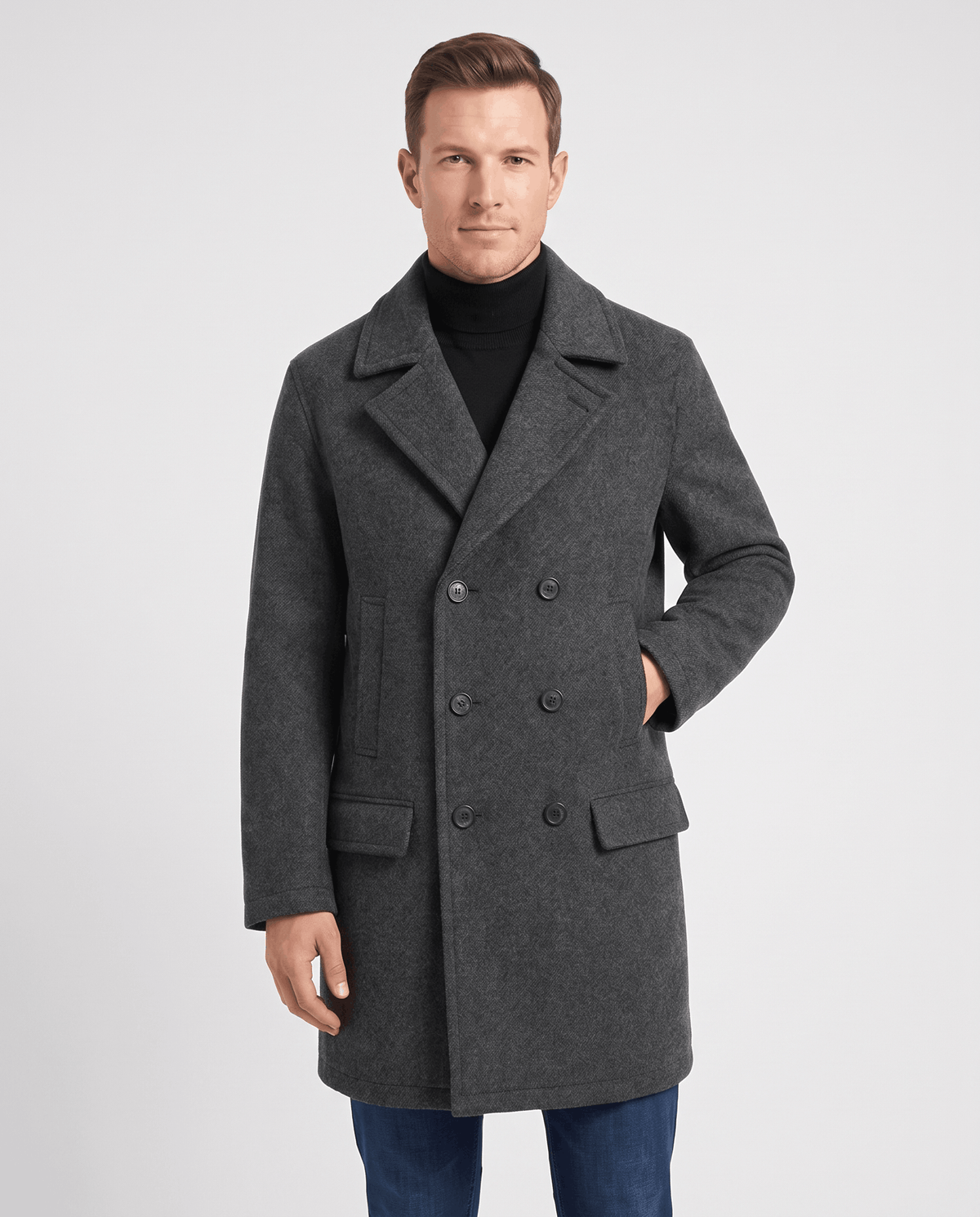 Dark gray double-breasted longline trench coat with tailored lapels worn by a male model