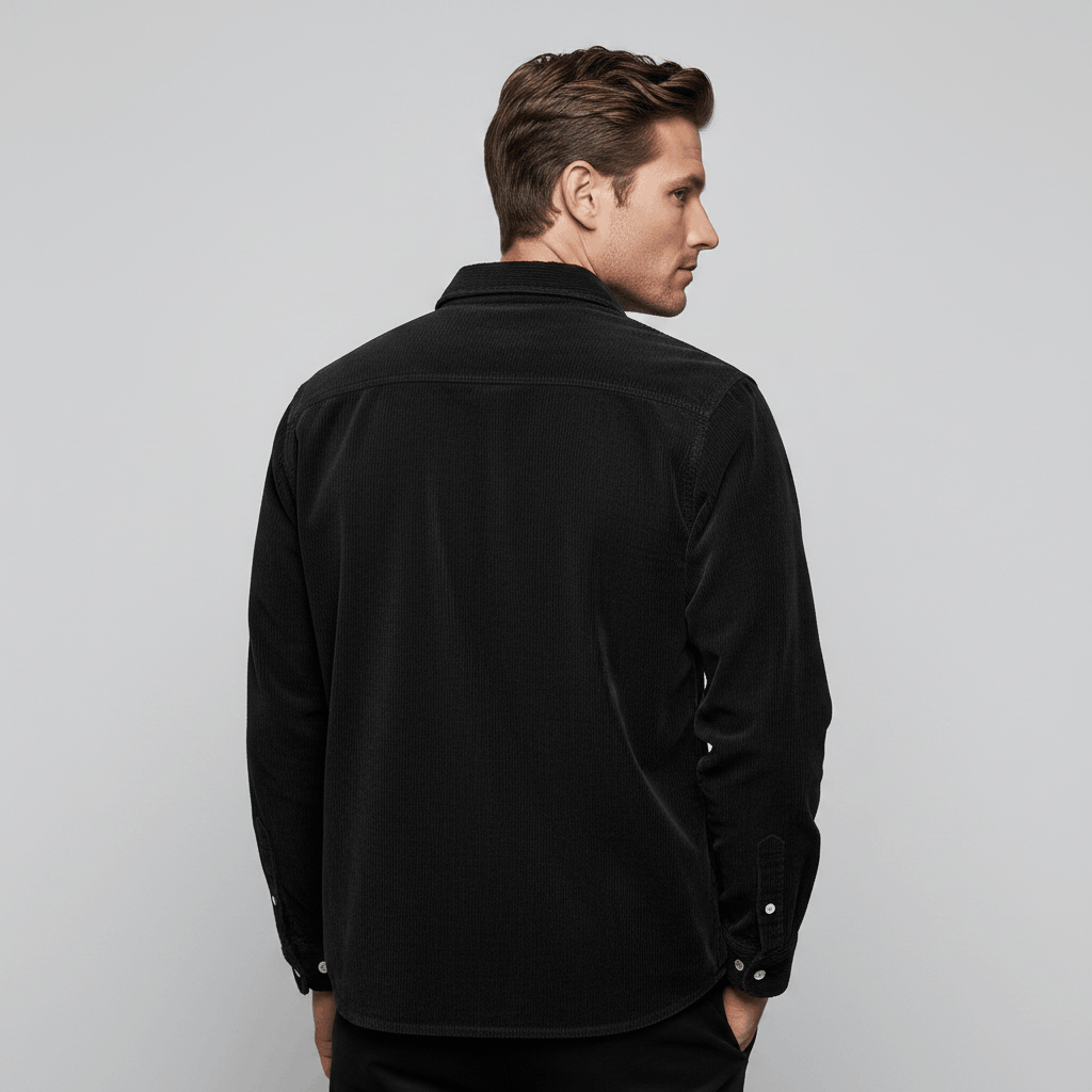 Dark blue fine wale corduroy long-sleeve shirt with a regular fit and curved hem, viewed from the back.