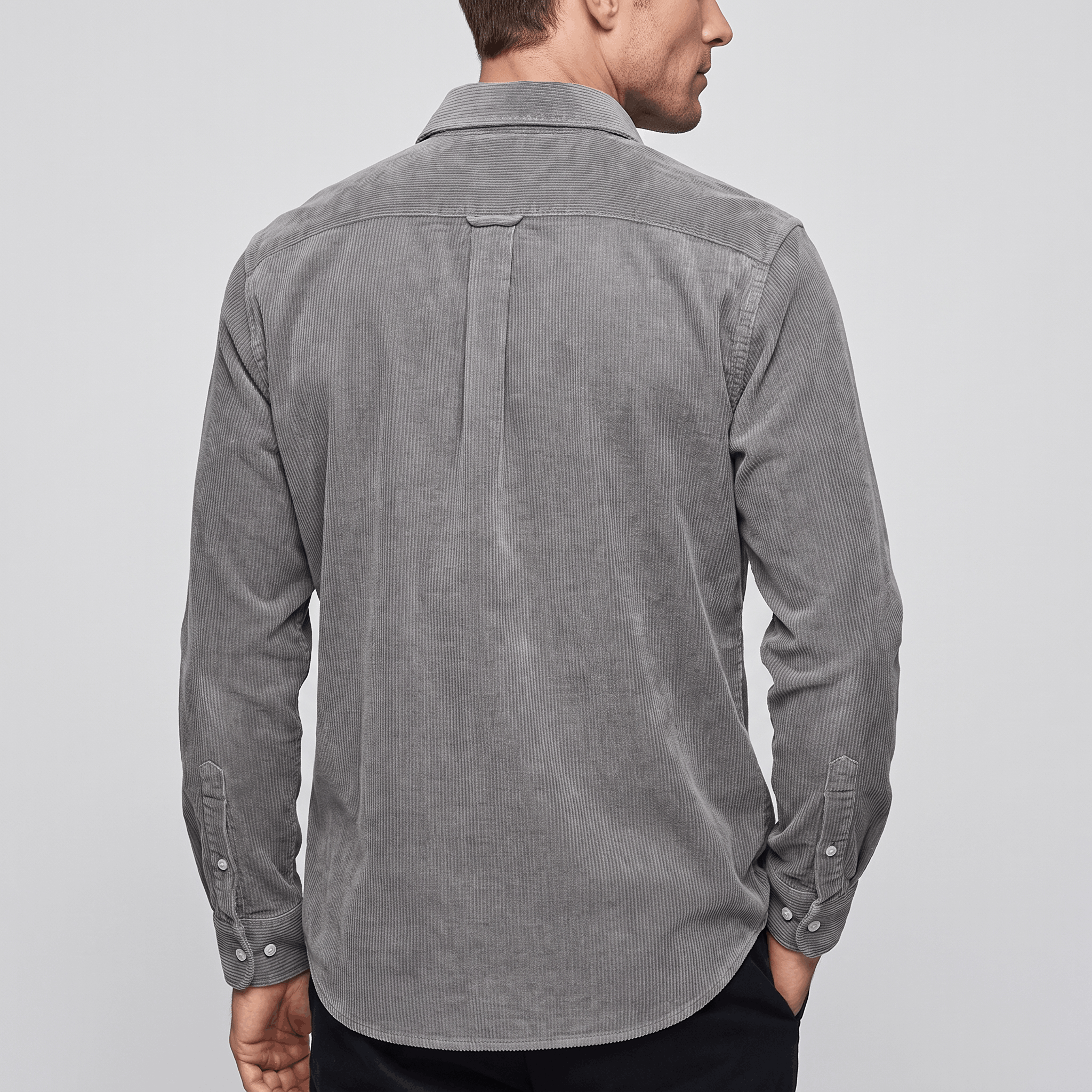 Washed blue fine wale corduroy shirt in a regular fit with a curved hem, shown from the back.