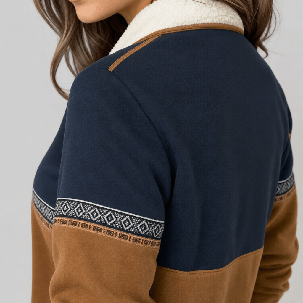 Back close-up showing the navy and brown color-block design of the pullover.
