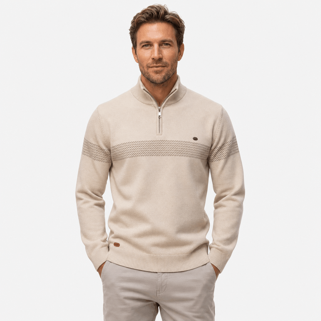 Male model wearing a beige quarter-zip sweater with a subtle textured horizontal stripe across the chest, paired with matching cream trousers, front view.