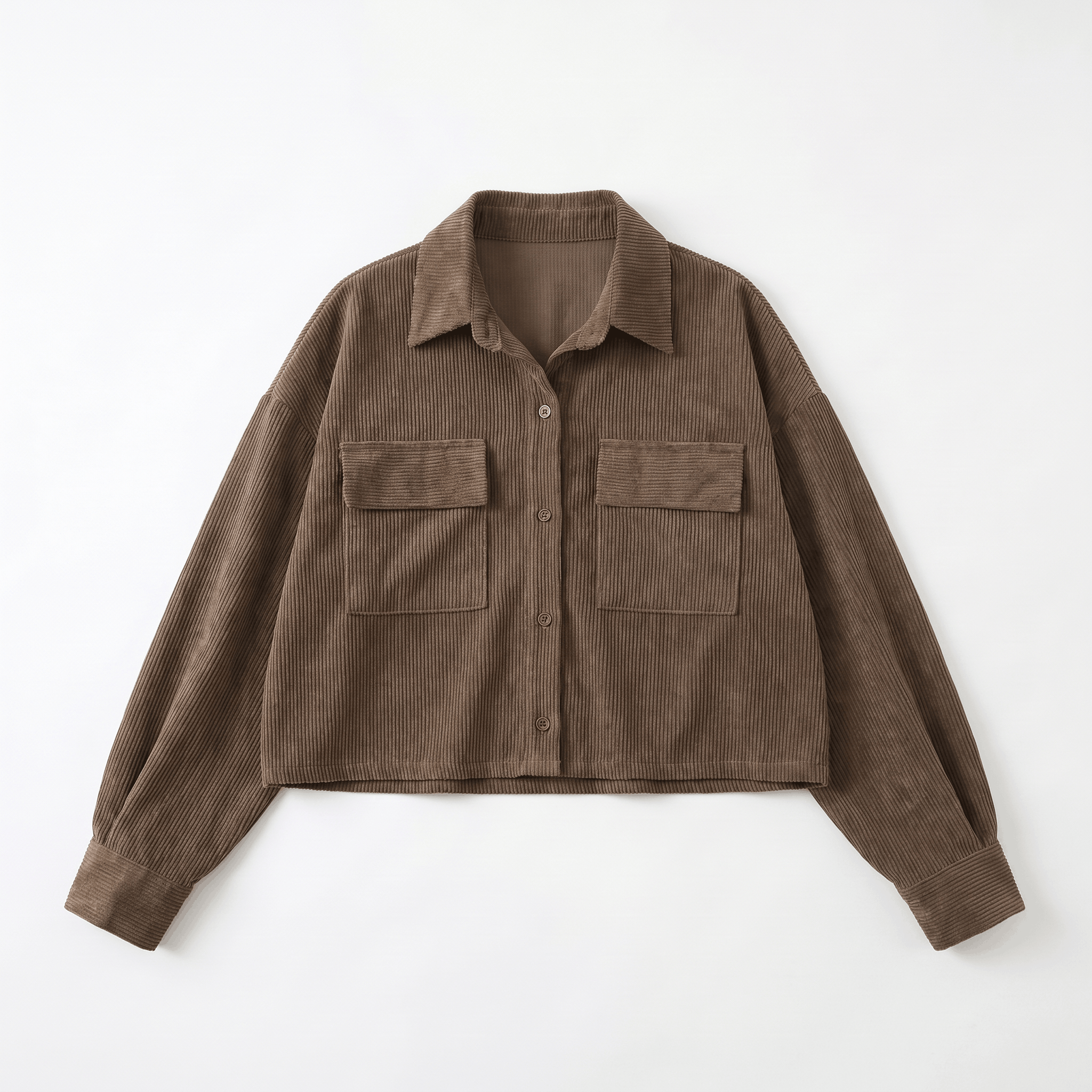 Muted brown corduroy overshirt with a relaxed drop-shoulder fit, button-front closure, and dual chest flap pockets.