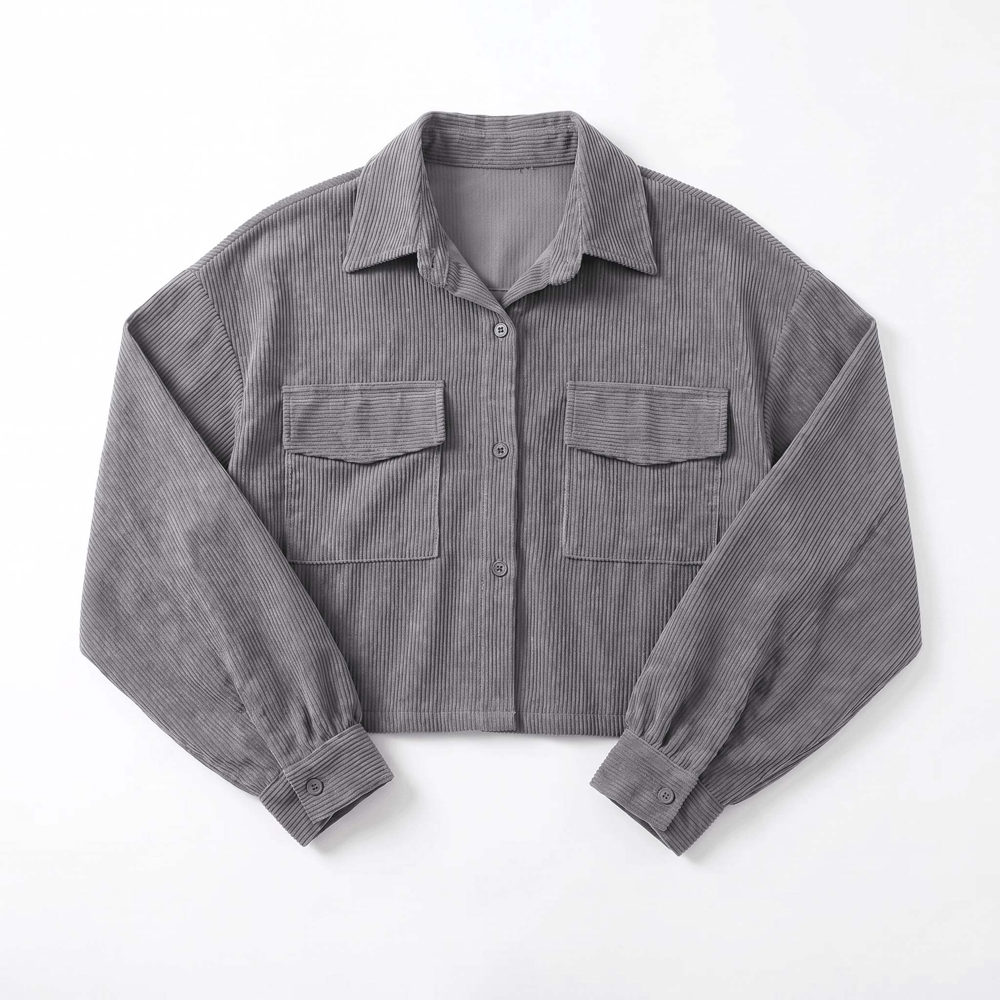 Muted brown corduroy overshirt with a relaxed drop-shoulder fit, button-front closure, and dual chest flap pockets.