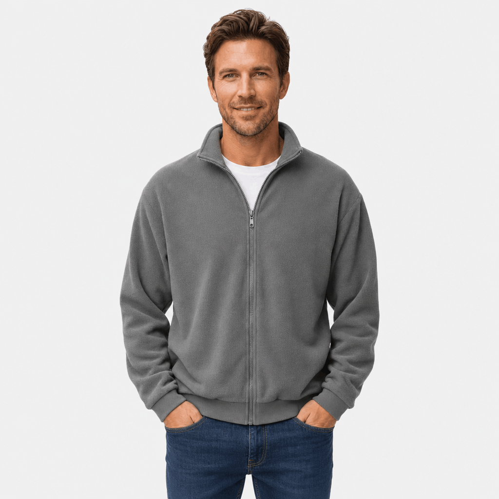 Male model wearing a gray zip-up jacket with hands in the side pockets.