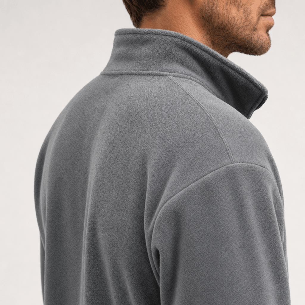 Close-up back and side view of the gray jacket, highlighting the raised stand collar and shoulder.