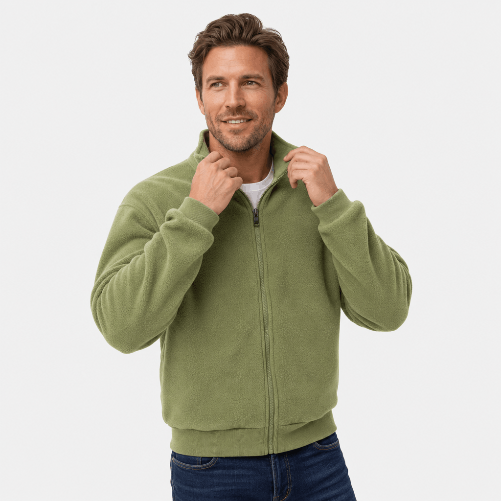 Male model wearing an olive green zip-up jacket with a stand collar, adjusting the collar with both hands.