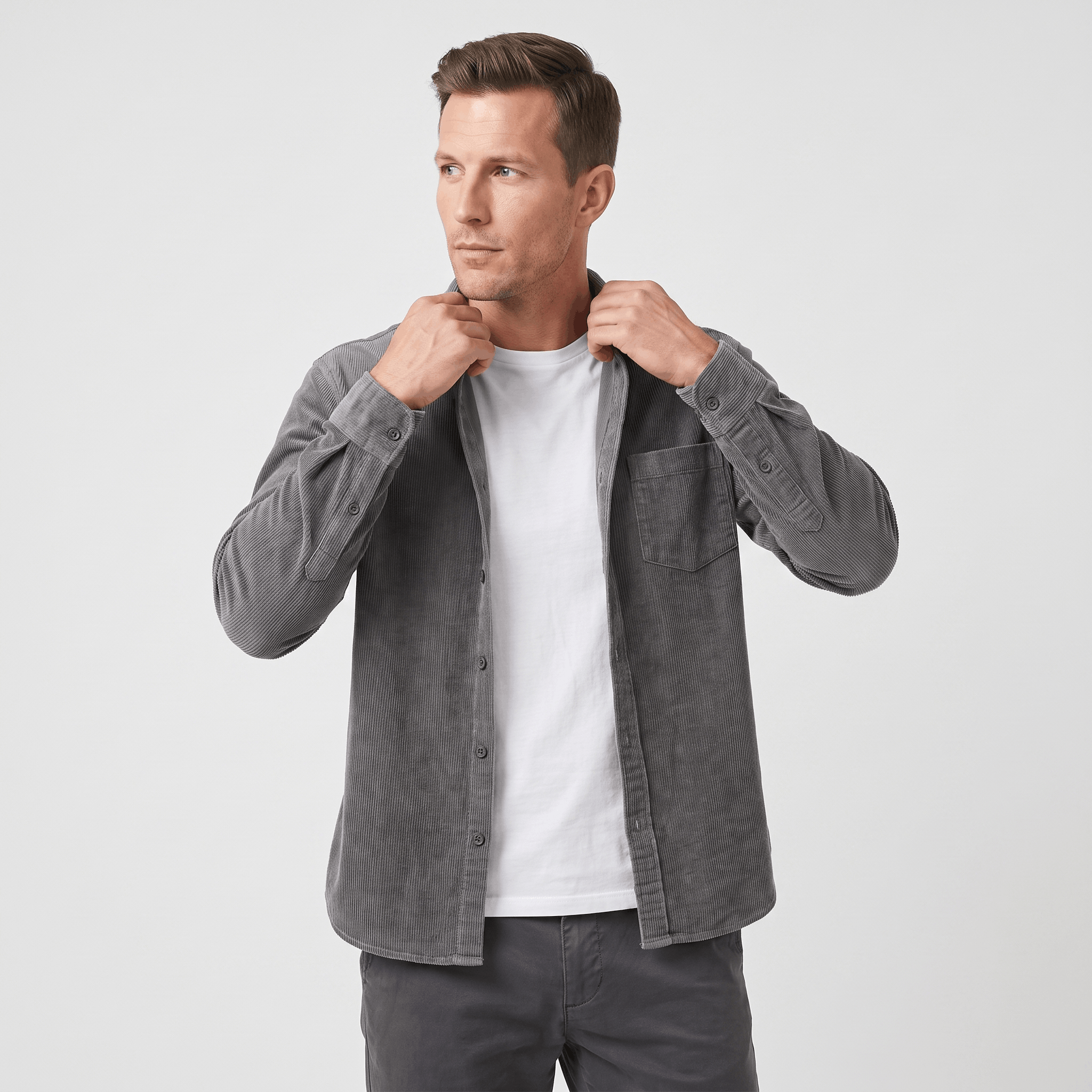 Grey washed corduroy button-up shirt in a regular fit with a single chest pocket, worn open over a white t-shirt.