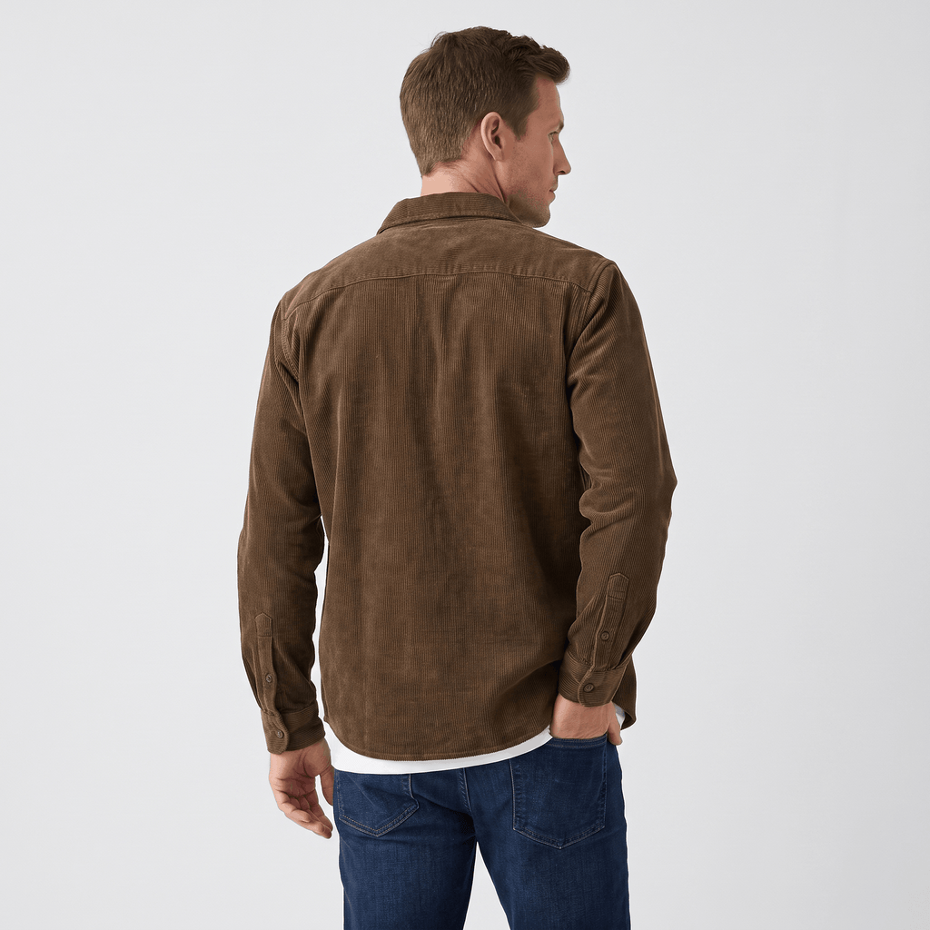 Brown washed corduroy button-up shirt in a regular fit, worn over a white tee with blue denim jeans.