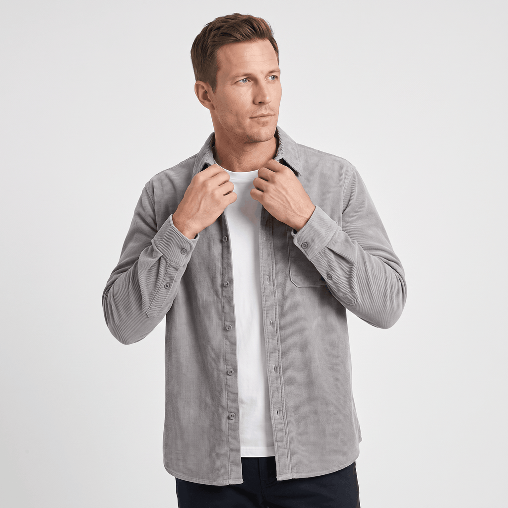 Grey washed corduroy button-up shirt in a regular fit, worn open over a white t-shirt with a single chest pocket.