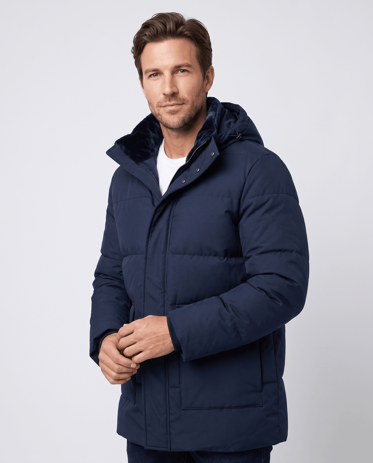 A man wearing a navy blue fleece-lined winter jacket with a hood, full-zip front, and regular fit