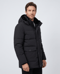 A man wearing a black fleece-lined winter jacket with a hood, full-zip front, and regular fit