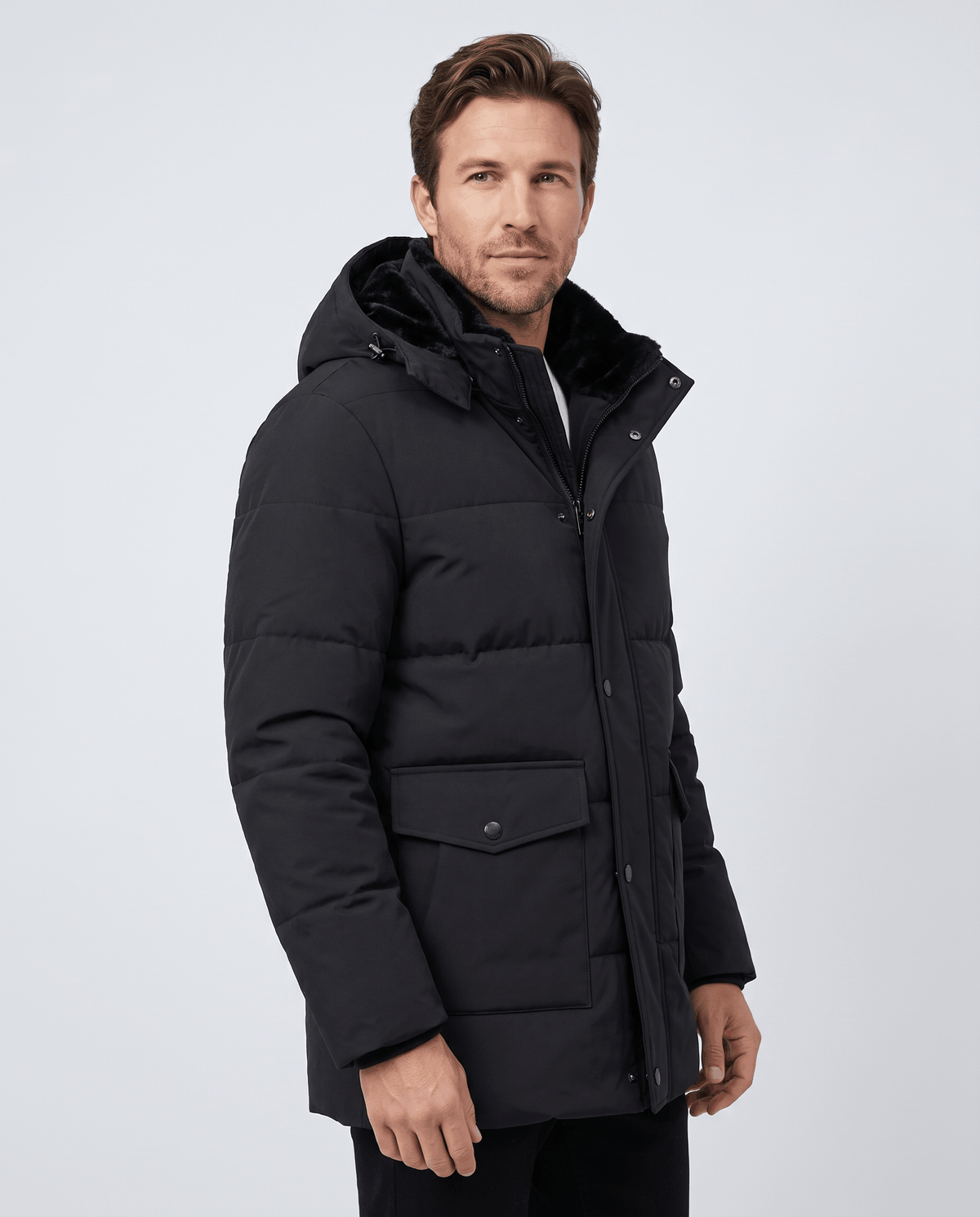 A man wearing a black fleece-lined winter jacket with a hood, full-zip front, and regular fit