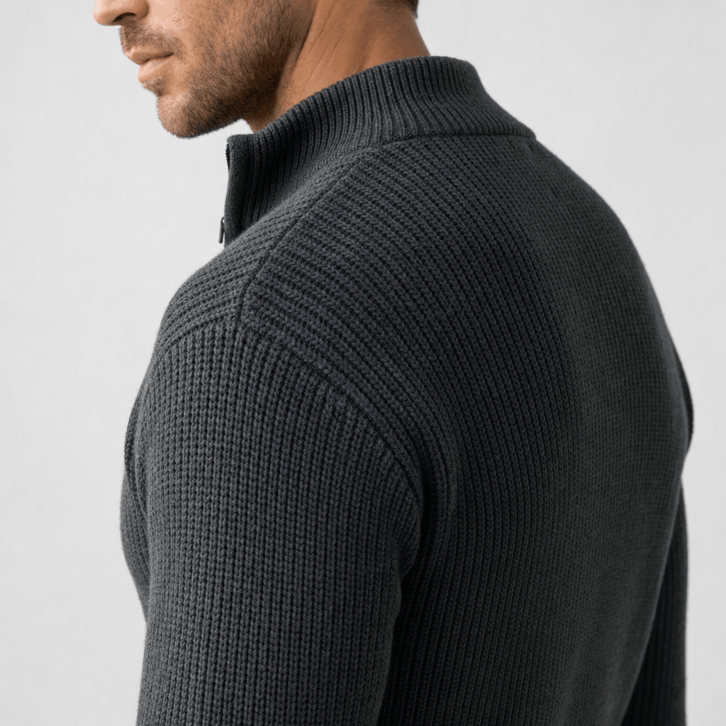 Side close-up showing the ribbed knit texture and raised collar of the charcoal gray sweater.