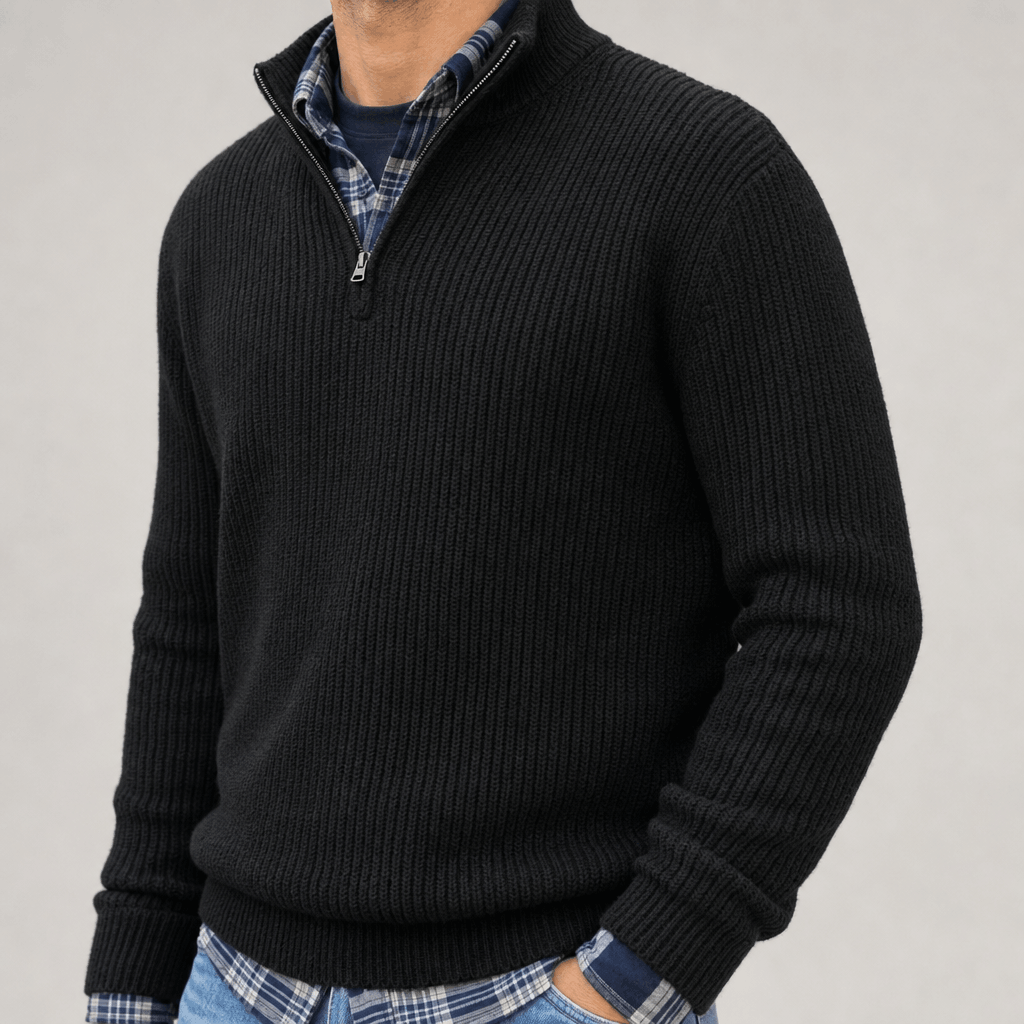 Close-up of the black quarter-zip sweater, highlighting the ribbed knit texture and collar.
