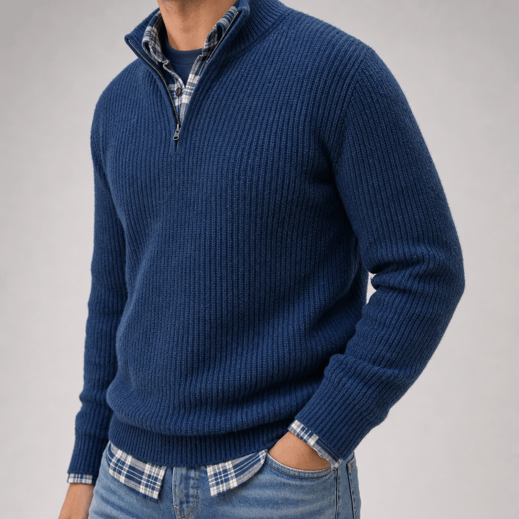 Close-up of the navy blue ribbed knit quarter-zip sweater, showing the textured knit and raised collar.