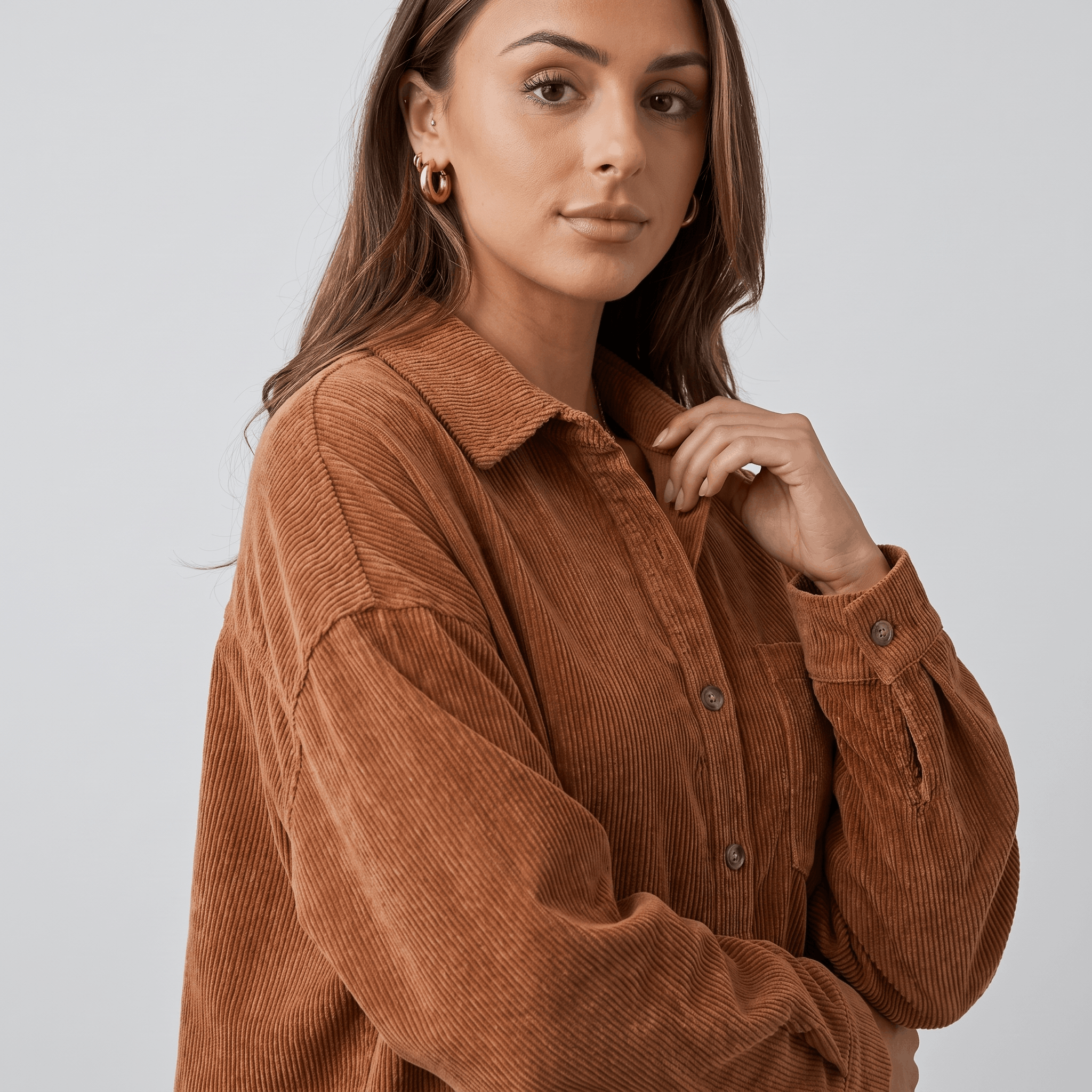 Rust-toned corduroy button-down shirt with a relaxed, oversized fit, drop shoulders, and a classic point collar.