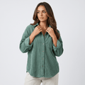 Oversized green corduroy button-down shirt with a point collar, drop shoulders, and rolled cuffs in a relaxed fit.