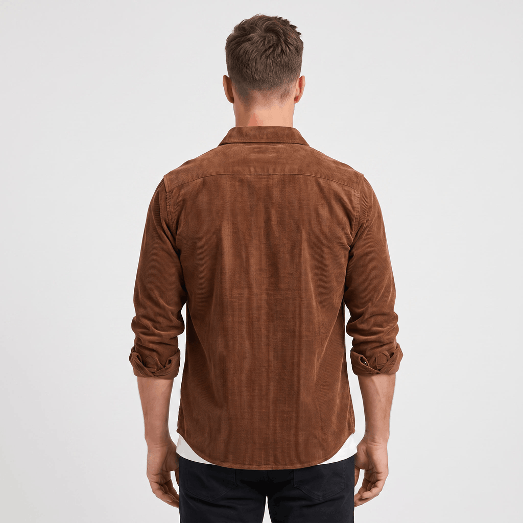 Slim fit brown corduroy shirt with long sleeves rolled up, featuring a clean back yoke and tailored silhouette.