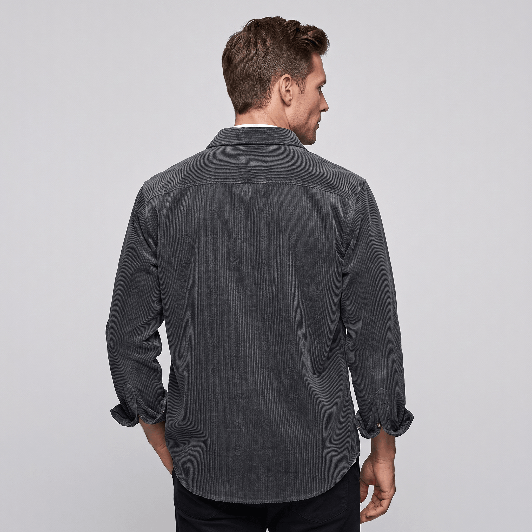 Charcoal grey cotton corduroy shirt featuring a relaxed fit, point collar, and long sleeves with buttoned cuffs.