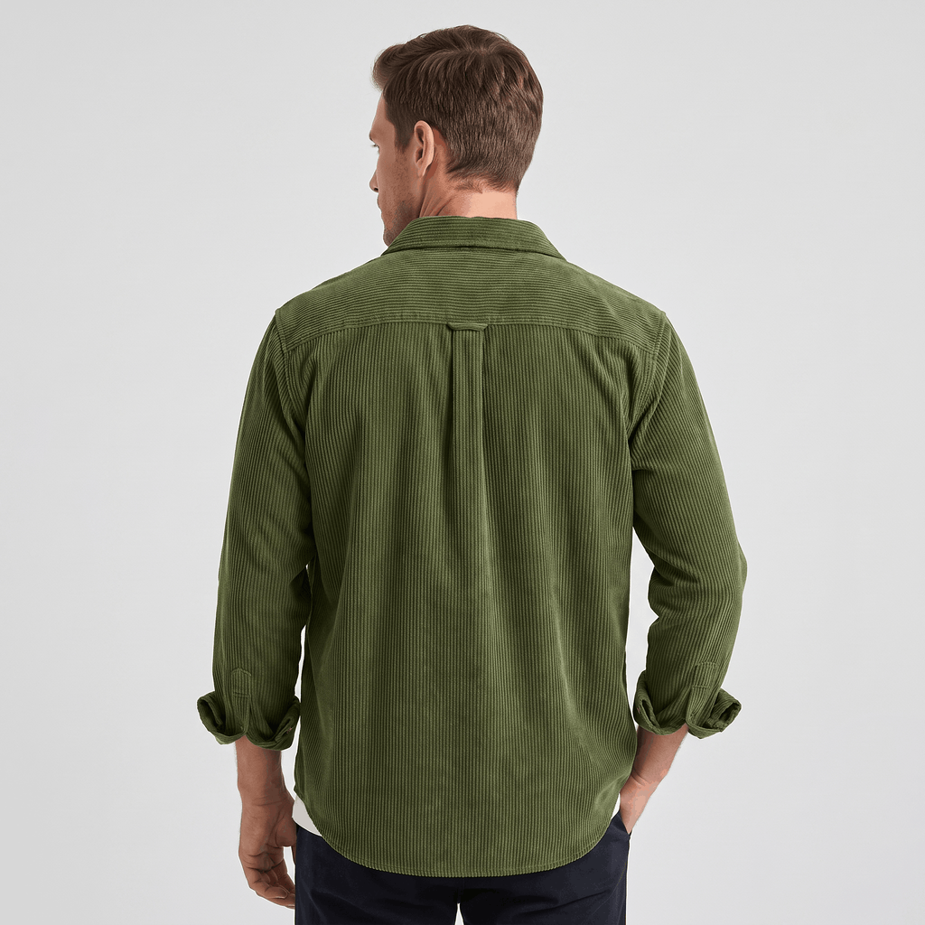 Olive green cotton corduroy shirt featuring a relaxed fit, back box pleat, and cuffed long sleeves.